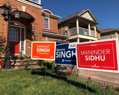 Election lawn signs for the conservatives, liberals and NDP.