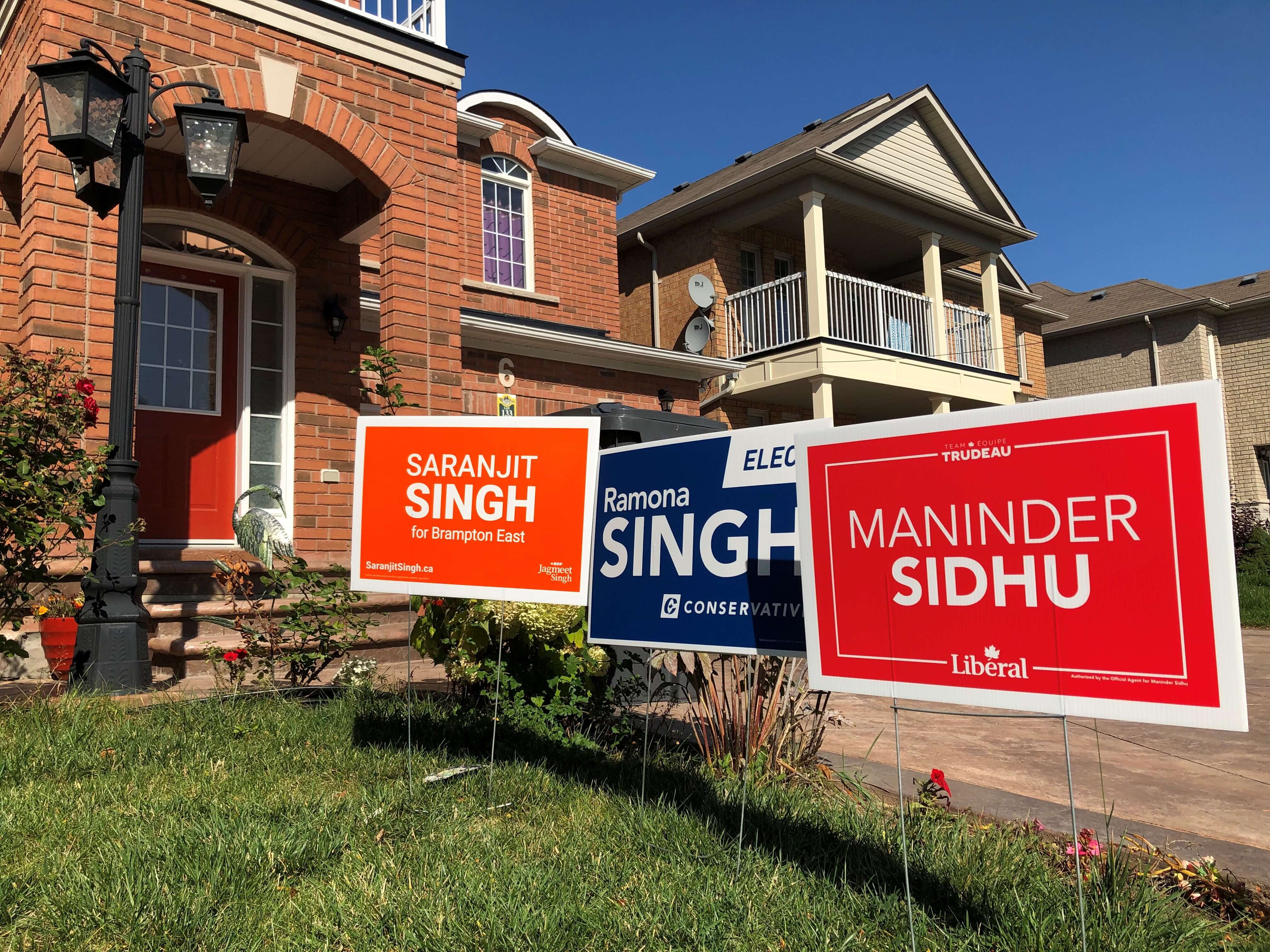 Election lawn signs for the conservatives, liberals and NDP.