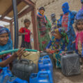 People fetch water provided by Solidarités International, an EU-supported aid group, in Yemen's Hodeida Governorate.