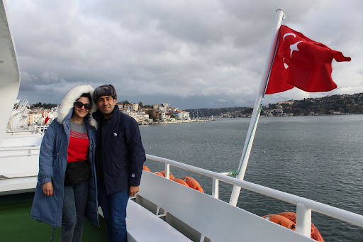 Milad Jamal Soltani with his wife on a ferry in Turkey to visit a visa application centre