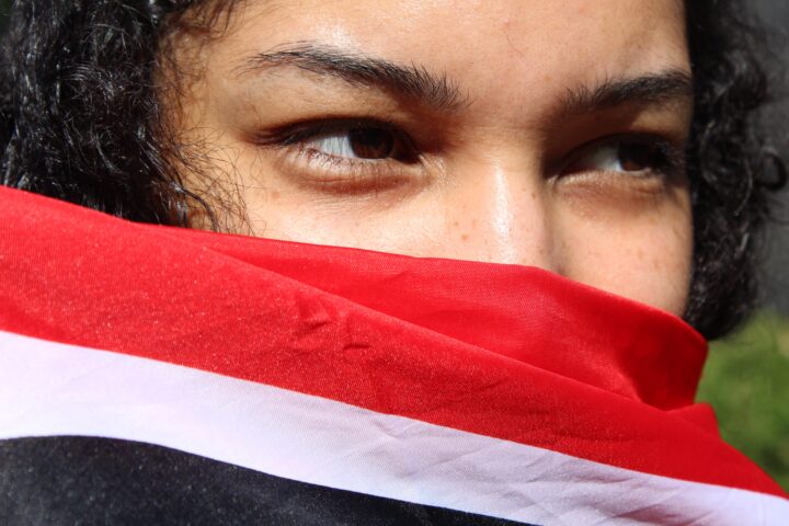 Johanna Venti holding the Trinidad and Tobago flag