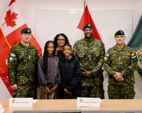 (From left to right) former Brigade Sergeant Major, Chief Warrant Officer G.R Colgan; Isabelle Mbaho, Anita Sanghara-Mbaho, Jahan Mbaho, Captain William Mbaho, and Colonel Scott Raesler the commanding officer of 39 Canadian Brigade Group in BC