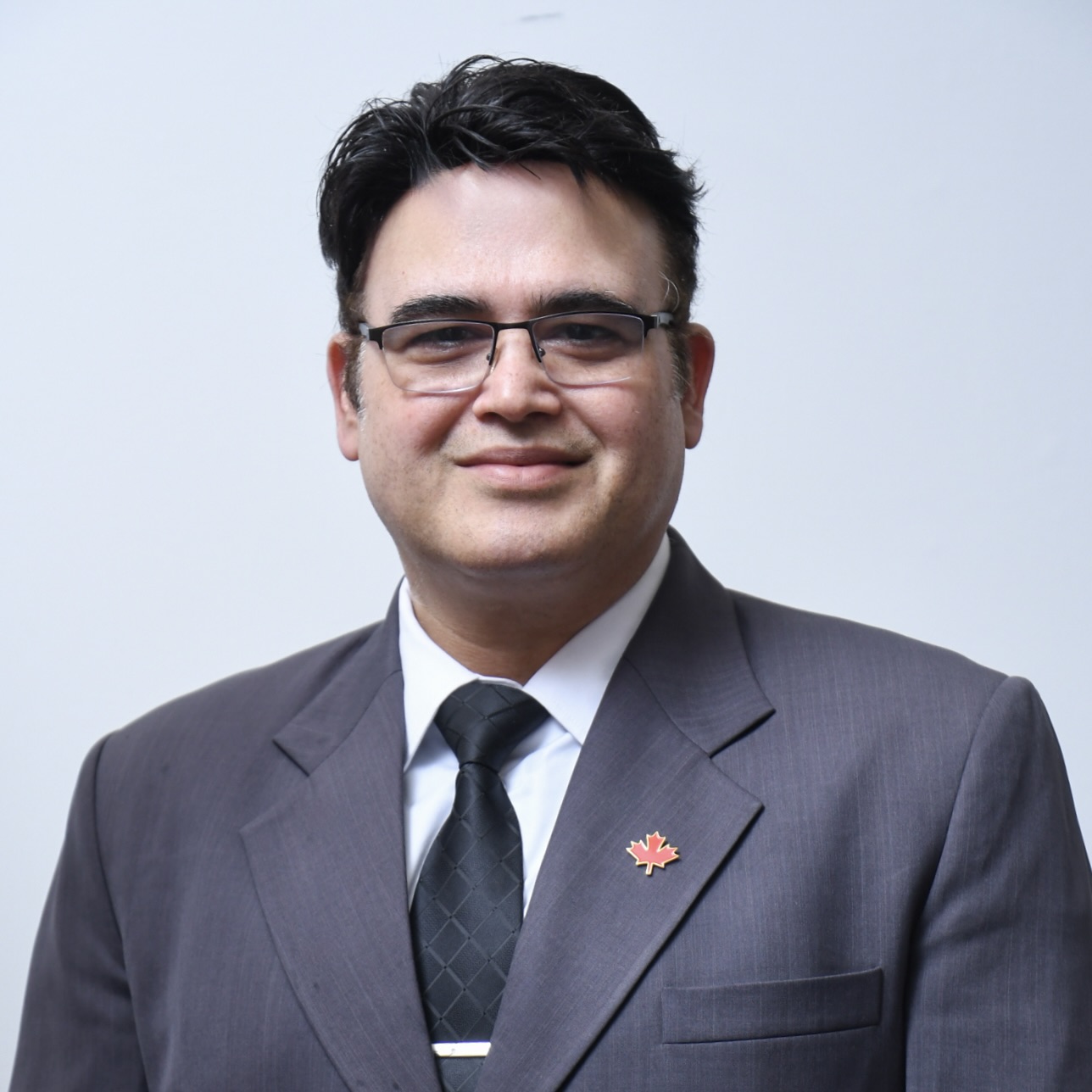 Headshot of Vikas Chauhan, a graduate of Queen's University's Graduate Diploma in Immigration and Citizenship Law program.