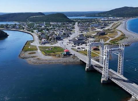 Aerial view of Placentia, Newfoundland and Labrador, showing the town's waterfront, harbour and the elevated bridge crossing the Gut that connects Placentia and Jerseyside.